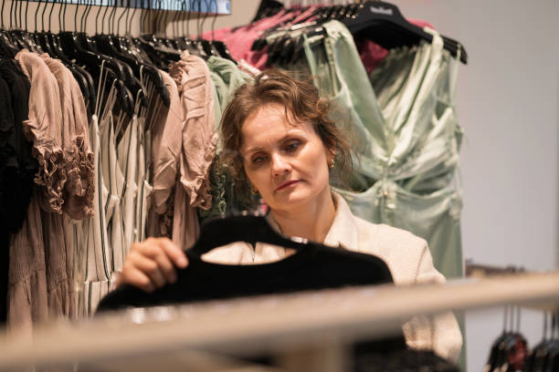 istock woman shopping in a retail store 2144177438