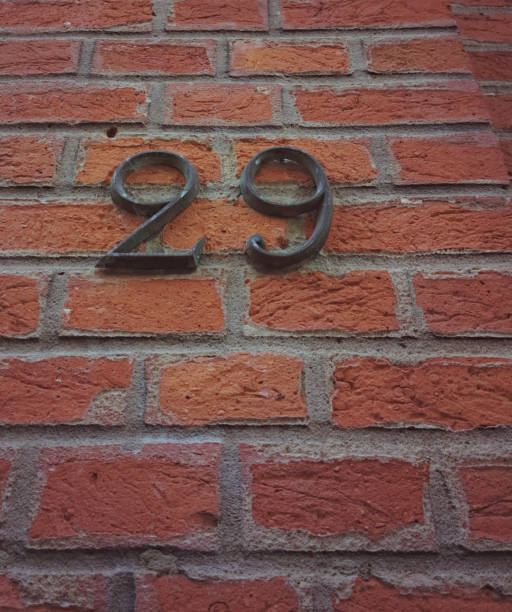 istock Metal covered with old black paint number twenty nine or 29 2144385101