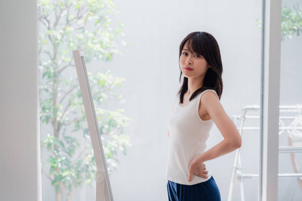 istock Young women who are concerned about their body shape 2144395114