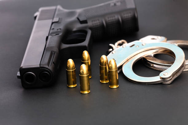 istock Hand gun with ammunition on dark background. 2144428681