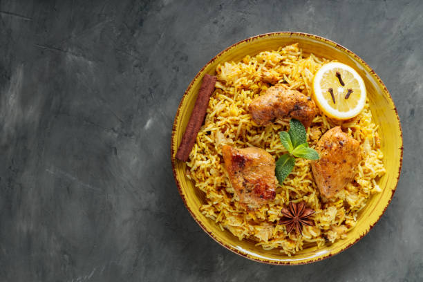 istock Indian Traditional Chicken Biryani Rice in Plate on Dark Background, Copy Space, Top View 2144474635