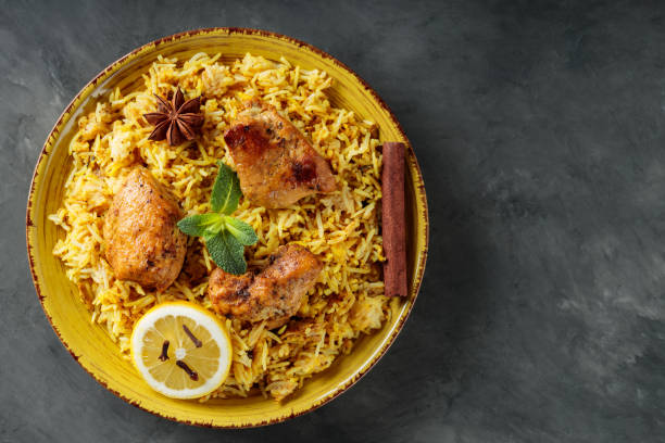 istock Indian Traditional Chicken Biryani Rice in Plate on Dark Background, Copy Space, Top View 2144475136