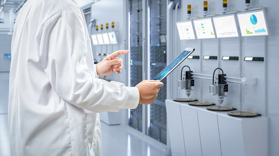 Worker or engineer wears lab coat work in semiconductor manufacturing factory
