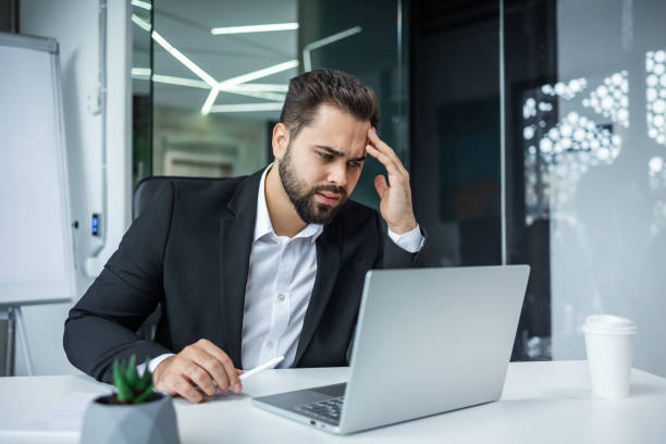 istock business man employee manager using computer looking at laptop worried. deadlines issue 2144535908