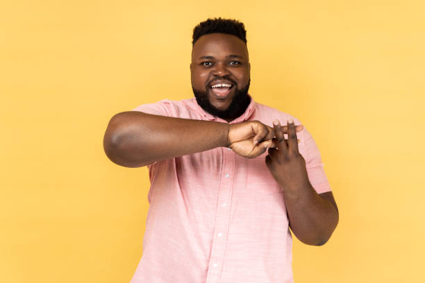 istock Man making hashtag sign with fingers, looking at camera with smile, tagging posts in social networks 2144546624