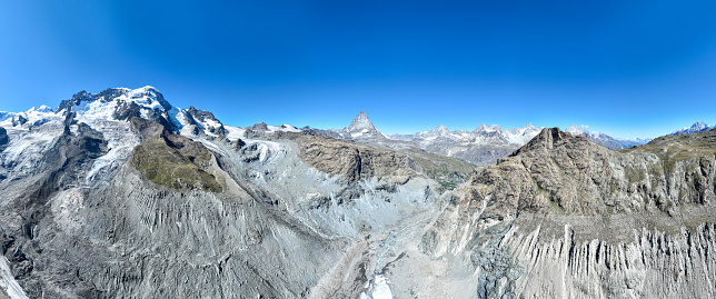 Serene summer landscape, the famous Matterhorn mountain in Zermatt, Switzerland, gently mirrors its grandeur in the calm waters of Riffelsee. Breathtaking alpine view. Beautiful landscape.