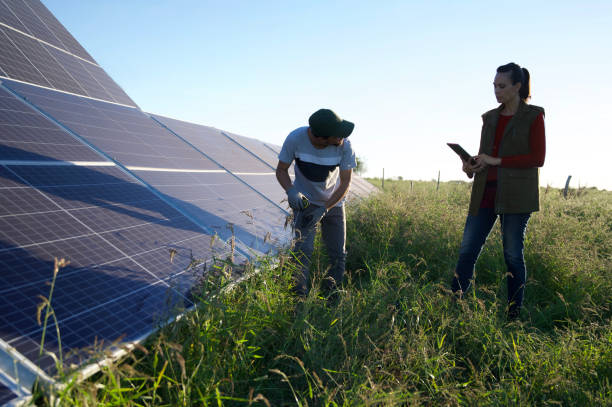 istock man and woman working in solar panels using sustainable energy 2144739121