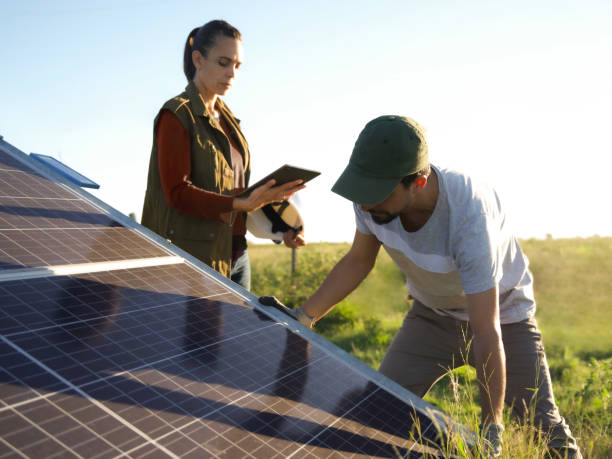 istock man and woman working in solar panels using sustainable energy 2144739590