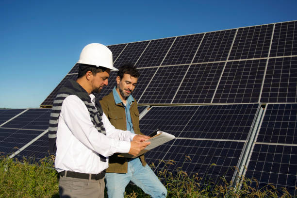 istock group of workers in solar panels using sustainable energy 2144745192