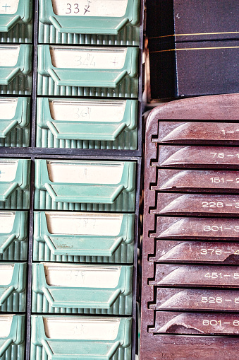 Drawers filled with the essence of timekeeping are cataloged with care in a watchmaker's haven