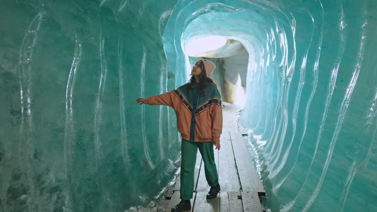 Woman exploring ice cave