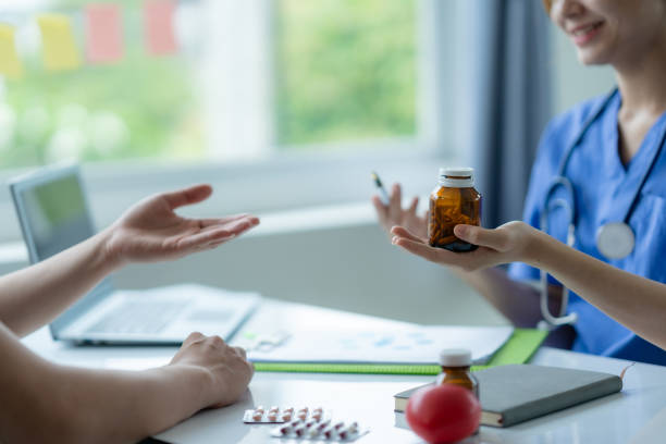 istock Nurse is explaining medication to a patient. 2144958423