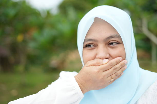 istock Cover your mouth with your hand 2144959654