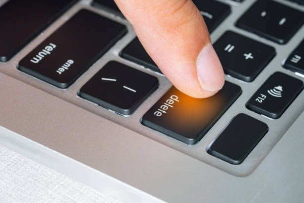 istock Finger of the computer user, he presses the delete button on the computer keyboard. 2144962804