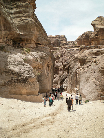 Wadi Musa, Jordan, April 18, 2008 : Numerous tourists pass through the gorge Al Siq of Historical Reserve of Petra near the city of Wadi Musa which is home to Petra in Jordan