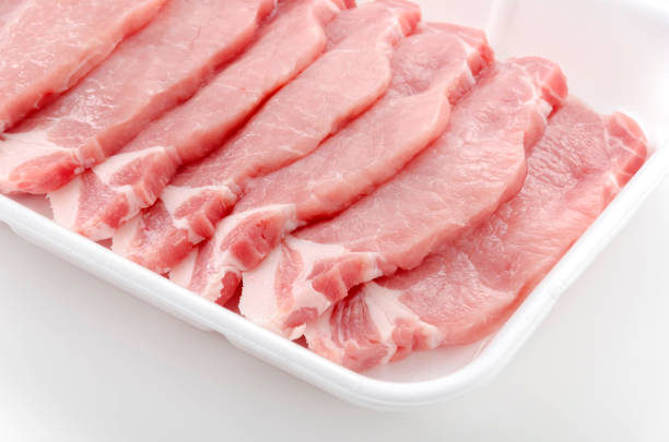 Pork meat inside styrofoam tray in White background.