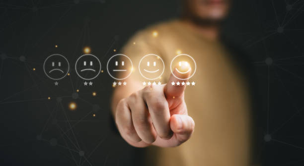 istock Customer service evaluation concept. Business people are touching the virtual screen on the happy Smiley face icon to give satisfaction in
service. rating very impressed. 2145039183