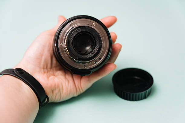 istock Holding Camera Lens Showing Rear Element and Mount 2145062099
