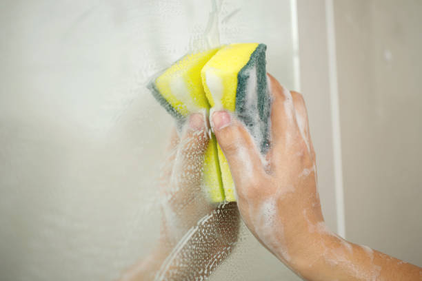 istock Clean the mirror in the bathroom 2145095930