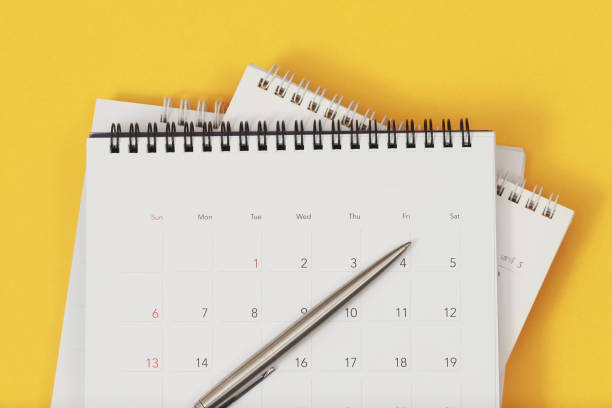 istock A pen with calendar on yellow background 2145103207