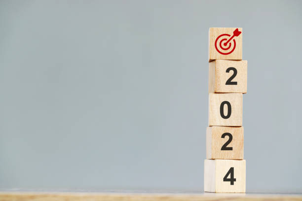 istock wood cube block with growth according to business goals 2145124598