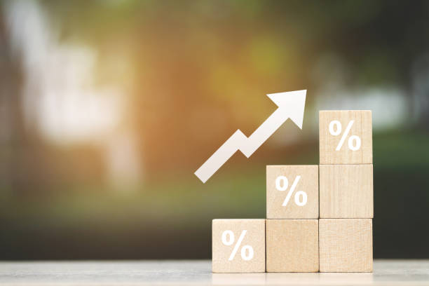 istock wood cube block with growth according to business goals 2145124602