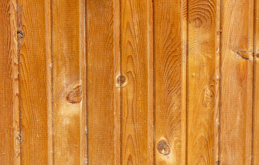 Wooden boards on the fence as an abstract background. Texture.
