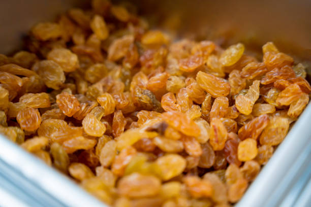 Nuts and dried fruits for making handmade chocolates and candies in a workshop.