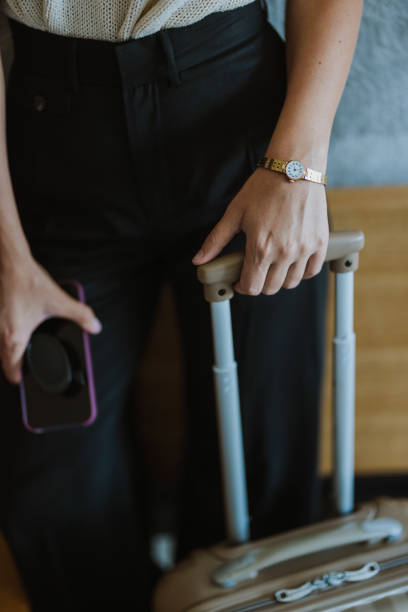 istock Unrecognizable Woman Preparing to Leave a Hotel Room With a Suitcase 2145191611