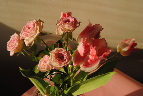 Bouquet of pink roses and tulips