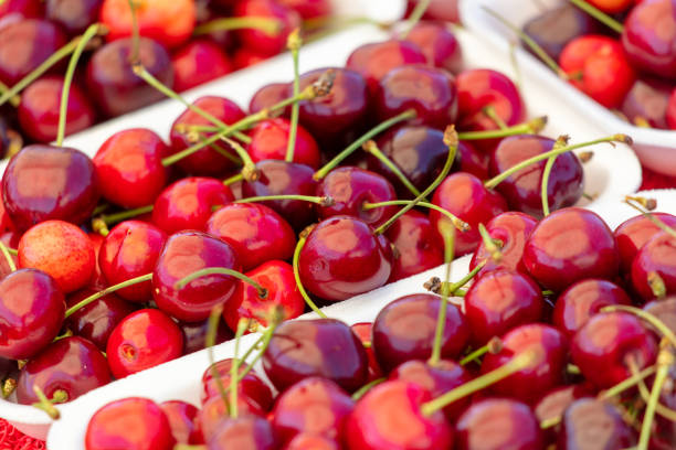 istock Fresh cherries on the counter in the market 2145235425
