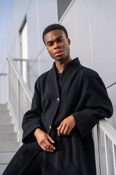 istock African model posing with black clothes railing on stairs 2145247449