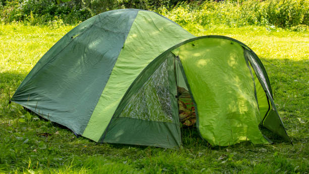 istock Tourist tent on green grass 2145248014