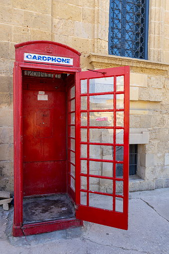 Valletta, Malta, April 03, 2024.  an old telephone booth in the city center