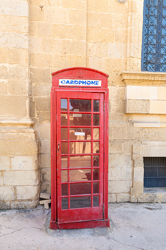 Valletta, Malta, April 03, 2024.  an old telephone booth in the city center