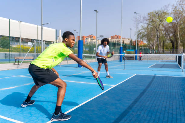 istock Friends having fun during pickleball match outdoors 2145258151