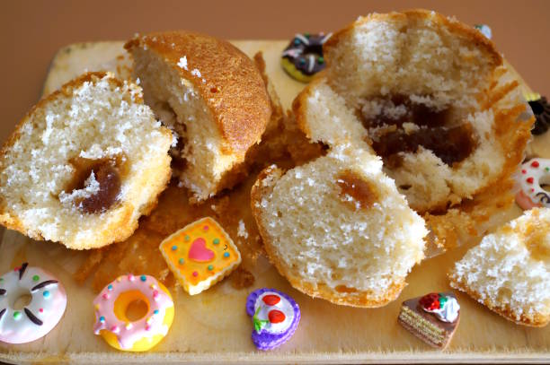 istock Sliced muffins with toy cakes. 2145347706