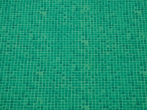 Tiles on the bottom of the pool. The background image.
