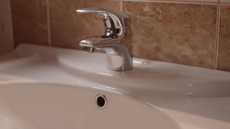 Faucet and sink without water highlighting essential role skin hygiene. Faucet and sink necessity of clean surfaces in promoting overall well-being and disease prevention Faucet and sink in kitchen.