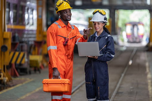 Engineering supervisor uses laptop to do diagnostics, enter data, check maintenance schedules, discuss work orders with a technician. Ensure that CO2 emissions are reduced in overall train operation.