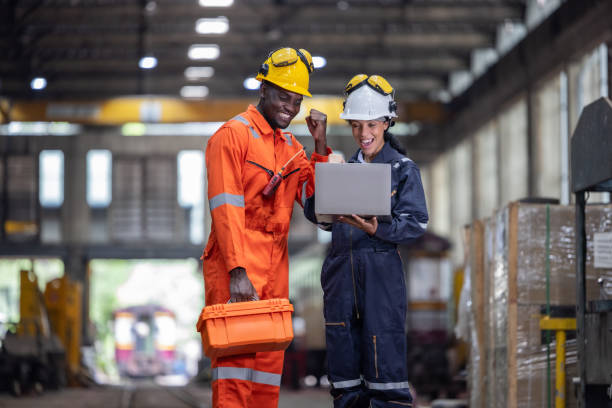 istock Engineer supervisor uses laptop for train diagnostics, maintenance, and CO2 reduction discussions. 2145433805