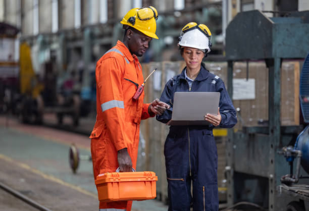 istock Engineer supervisor uses laptop for train diagnostics, maintenance, and CO2 reduction discussions. 2145436863