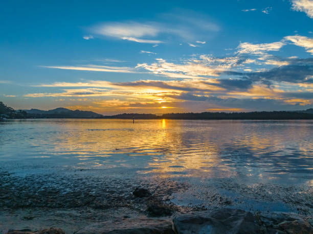 istock Sunrise, clouds, blue sky and water - a perfect day 2145461424