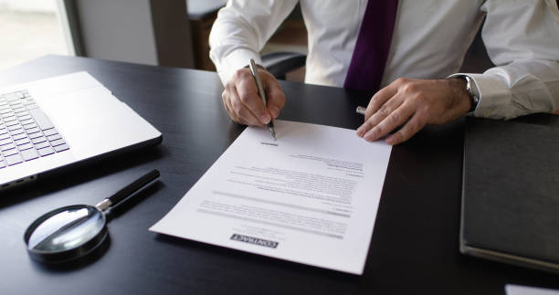 istock Businessman Signing Contract In The Office 2145472780