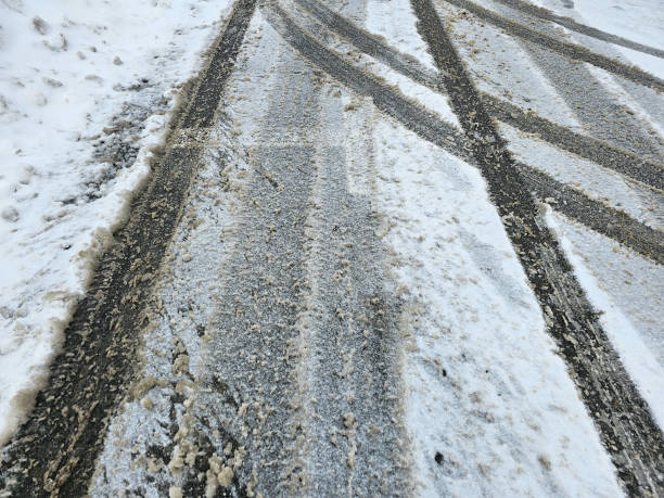 istock Tire Tracks Along Street 2145486147