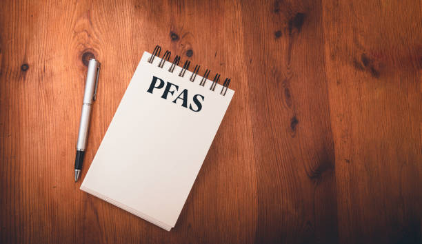 istock note pad on wooden table  with pfas, per- and polyfluoroalkyl substances , concept of eternal or forever chemicals and pollution ,copy space . 2145492905