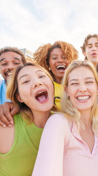 istock Multiethnic group of friends taking a happy selfie 2145591592