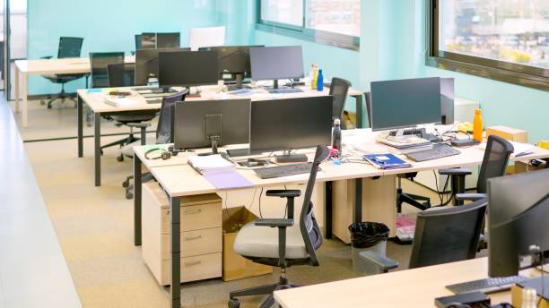 istock Quiet coworking space with computers and no people 2145591641