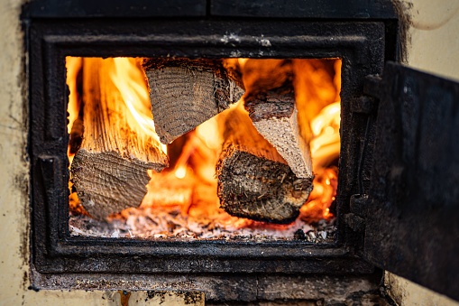 Burning firewood in a rural cottage