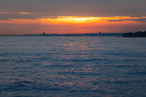 Sun is setting over by Marmara sea.\nIstanbul - Turkey.